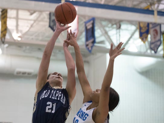 Old Tappan’s Alexandra George goes up with a shot in