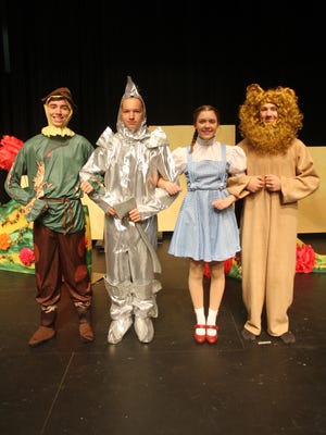 “The Wizard of Oz,” the movie generations of children grew up watching on TV every year, is coming to the stage of Williamsburg High School this weekend, Thursday, Nov. 2 and Saturday and Sunday, Nov. 4-5. Songs that endeared for many -- including the one from this iconic scene, “We’re Off to See the Wizard” -- are sure to trigger many fond memories of Dorothy’s fantastical trip to a wonderful world menaced by the evil Wicked Witch of the West. From left: Jurgen Dovre (the Scarecrow), Noah Elrod (the Tin Man), Annalissa Lane (Dorothy) and Spencer Vance (the Cowardly Lion).