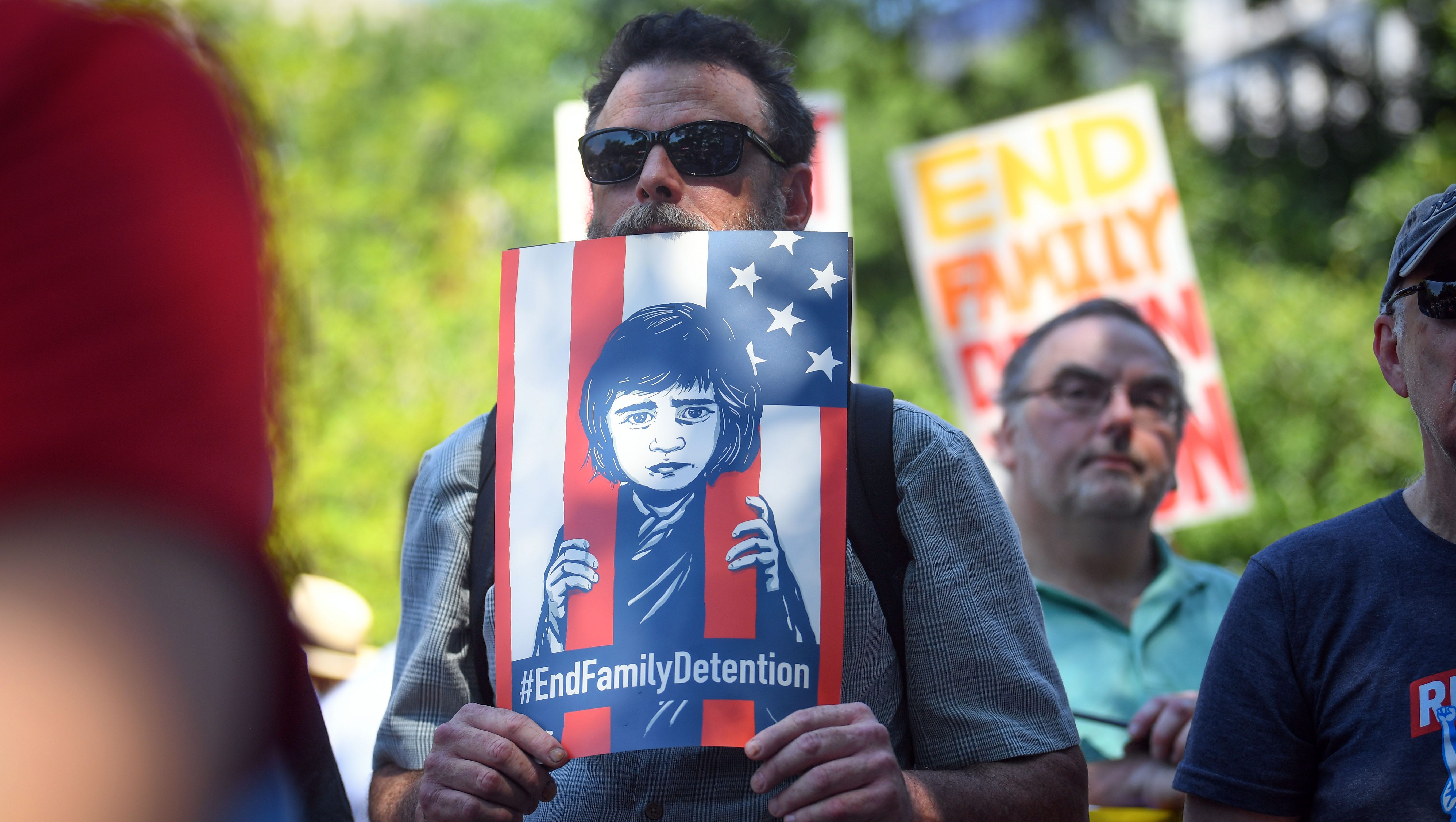 Protesters gather for the Families Belong Together