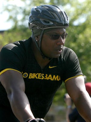 File photo shows Bo Jackson crossing the finish line during a previous "Bo Bikes Bama" charity event. The two-sport star from Auburn will join with Gov. Robert Bentley in Alexander City today for an event to discuss the upcoming event today in Alexander City.