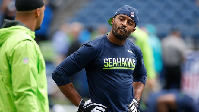 Seattle Seahawks wide receiver Doug Baldwin (89) talks with a teammate during pre game warmups against the Miami Dolphins at CenturyLink Field.