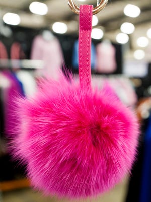 Pink keychain fob at the Henig Fur booth at the Tickled Pink Woman's Expo at the Multiplex at Cramton Bowl in Montgomery, Ala., on Friday September 30, 2016.