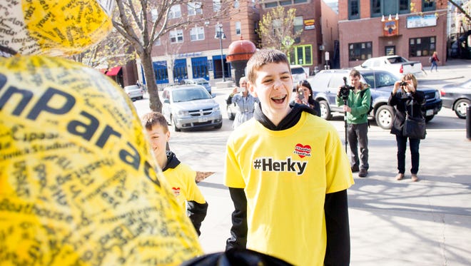 Patrick McCaffery, son of Iowa Men's Basketball Head Coach Fran McCaffery, smiles as he unveils the #Herky statue as part of the Herky on Parade series along Iowa Avenue in Iowa City, IA on Monday morning, May 5, 2014. Patrick, 14, had a tumor surgically removed from his thyroid in March 2014, which was shown to be cancerous. He was asked to unveil the #Herky statue after his own #TeamPat was recognized across the country including NBA star Chris Paul with the L.A. Clippers.