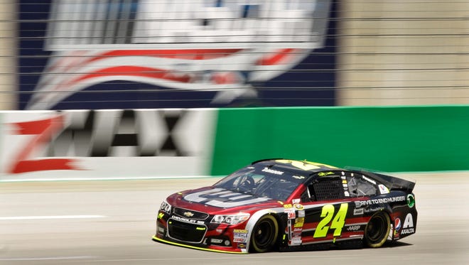 NASCAR driver Jeff Gordon speeds through a practice lap at Kentucky Speedway in Sparta, Ky., on Friday June 27, 2014. The NASCAR race is scheduled for Saturday night.