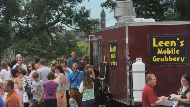 Leen's Mobile Grubbery serves up food during Food Truck Friday at the Bakery on Friday, June 19, 2015.