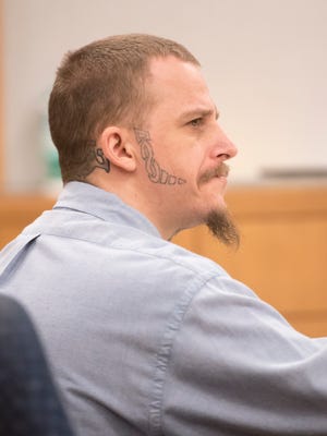 Robert Hunt listens to testimony during his murder trial Wednesday in Pensacola. Hunt was found guilty of second-degree murder in the stabbing death of a fellow inmate, Jorge Slaughter.