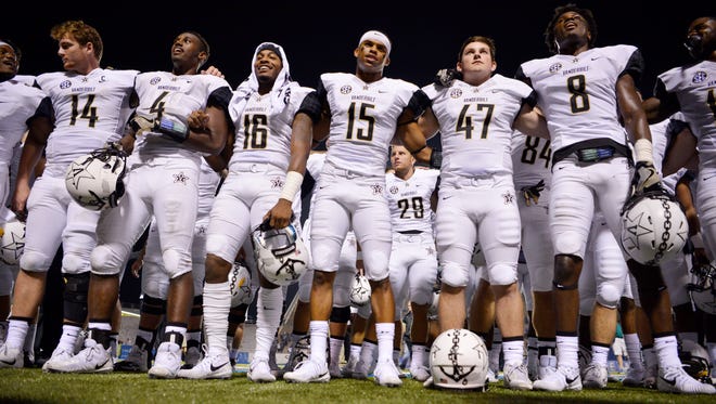 Vanderbilt players gather for the alma mater after the 28-6 win over MTSU in an NCAA college football game at Johnny "Red" Floyd Stadium in Murfreesboro, Tenn., Saturday, Sept. 2, 2017.