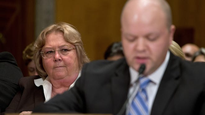 Veterans Affairs Deputy Inspector General Linda Halliday, listens at left, listens as Sean Kirkpatrick of Chicago, testifies on Capitol Hill in Washington, Tuesday, Sept. 22, 2015, before the Senate Homeland Security and Governmental Affairs hearing: "Improving VA Accountability: Examining First-Hand Accounts of Department of Veterans Affairs Whistleblowers."  (AP Photo/Jacquelyn Martin)