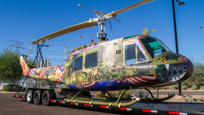Steve Maloney’s "Take Me Home Huey" art sculpture as seen at Glendale Municipal Airport on Nov. 1, 2015. The helicopter was shot down during the Vietnam War, and Maloney and Light Horse Legacy restored the helicopter from a bone yard. 