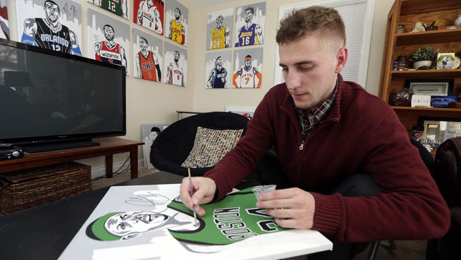 Ben Erickson, a Neenah High School and St. Norbert College graduate, paints portraits of famous NBA, NFL and MLB athletes at his studio in Whitefish Bay. A majority of Erickson's portraits have been autographed by the athletes.