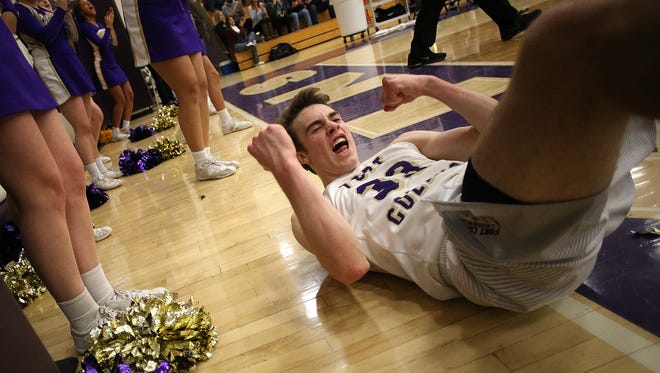 Fort Collins guard Jacob Pfaffinger reacts to a basket and foul during the Lambkins' second round playoff 79-66 win over the Broomfield Eagles on Saturday.