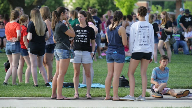 Members of the community arrive for a prayer vigil at Federal Hill Commons in Noblesville in response to Friday's shooting at Noblesville West Middle School.