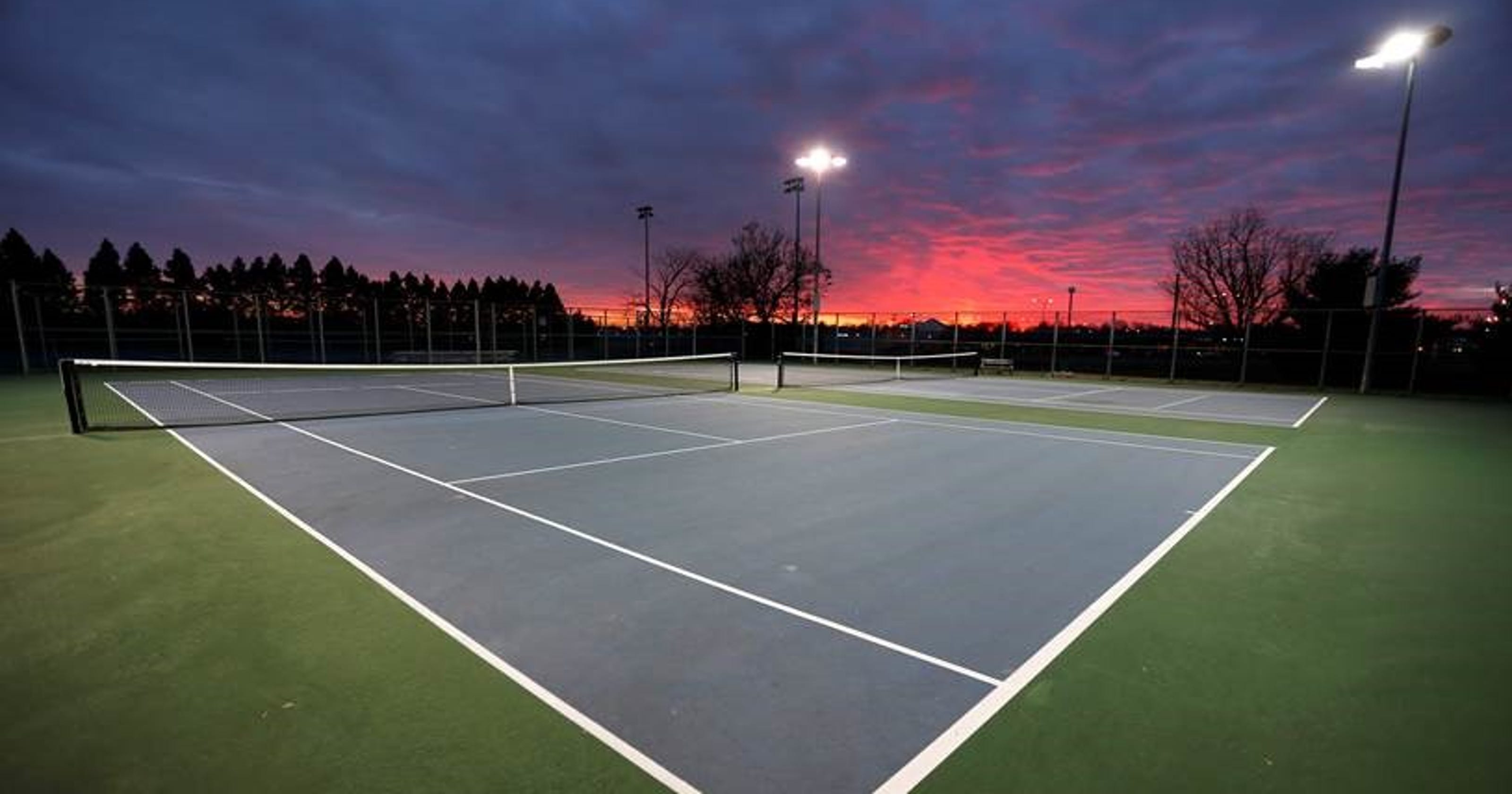 Answer Man: Why are tennis court lights on so late at night with no one