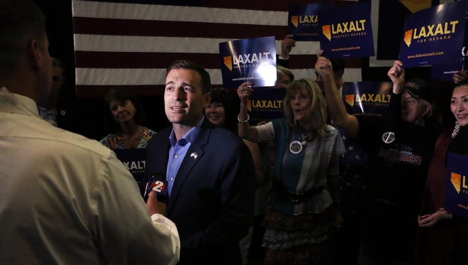Adam Laxalt, Republican candidate for Nevada governor, greets supporters at a campaign party on the night of the Nevada primary, June 12, 2018 at The Grove in Reno.