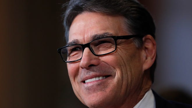 Energy Secretary-designate, former Texas Gov. Rick Perry, smiles as he testifies on Capitol Hill in Washington, Thursday, Jan. 19, 2017, at his confirmation hearing before the Senate Energy and Natural Resources Committee. (AP Photo/Carolyn Kaster)