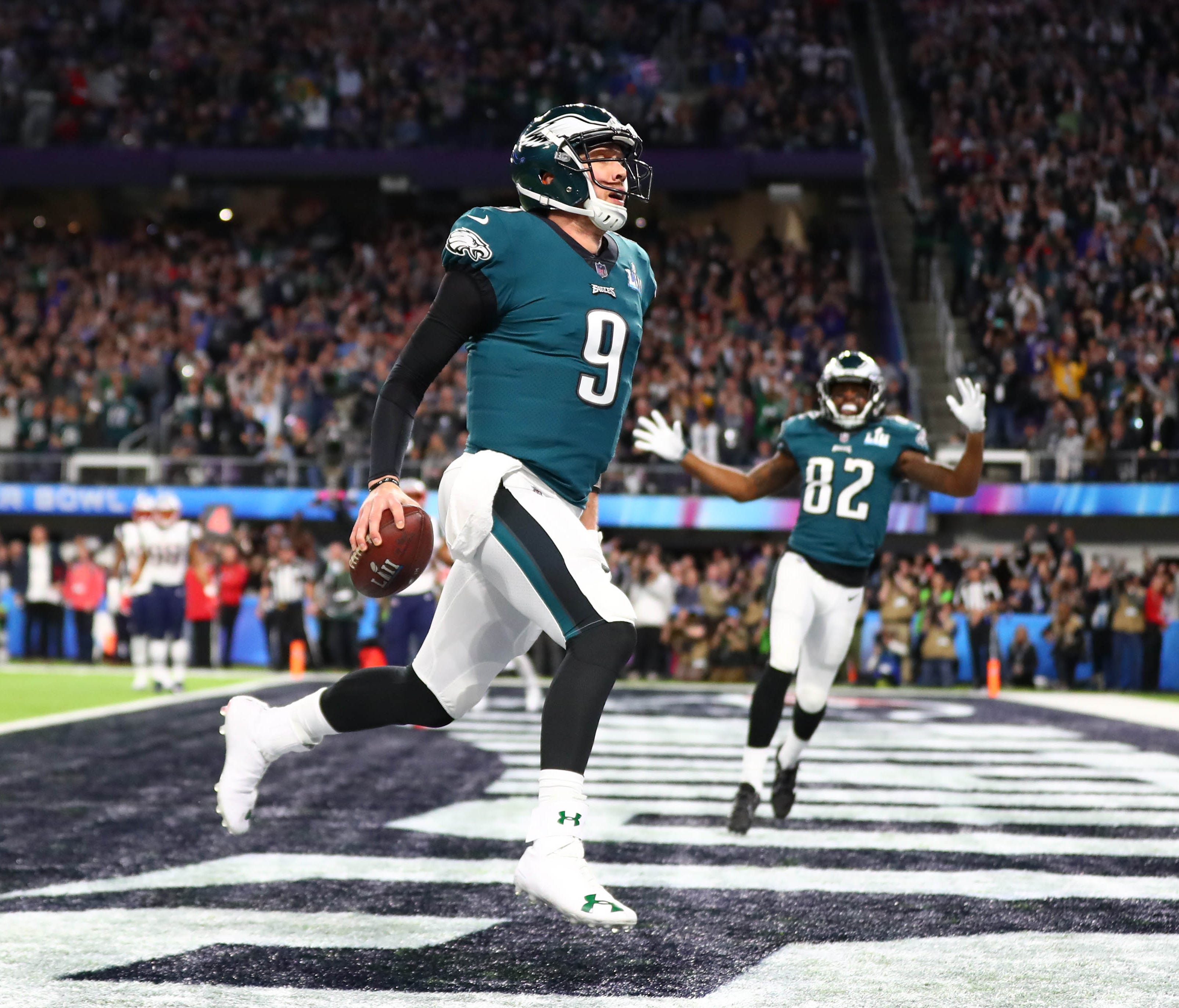 Philadelphia Eagles quarterback Nick Foles (9) catches a touchdown pass against the New England Patriots in the second quarter in Super Bowl LII at U.S. Bank Stadium.