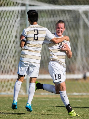 Anderson University freshman forward Magnus Einarsson (right) celebrates with teammate Anderson University senior defender Ryo Ogawa after scoring a goal at the Anderson vs. Queens men's and women's soccer double header on Wednesday, October 19, 2016 in Anderson. 