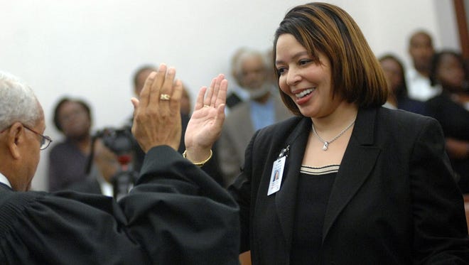Sherri Flowers is sworn in as Hinds County attorney by Judge Houston Patton during a ceremony at the Hinds County Courthouse in 2009.