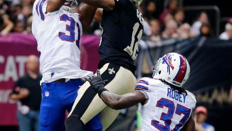 Buffalo Bills free safety Jairus Byrd (31) and defensive back Nickell Robey (37) break up a pass intended for New Orleans Saints wide receiver Marques Colston (12) during the first half of an NFL football game in New Orleans, Sunday, Oct. 27, 2013. (AP Photo/Bill Haber)