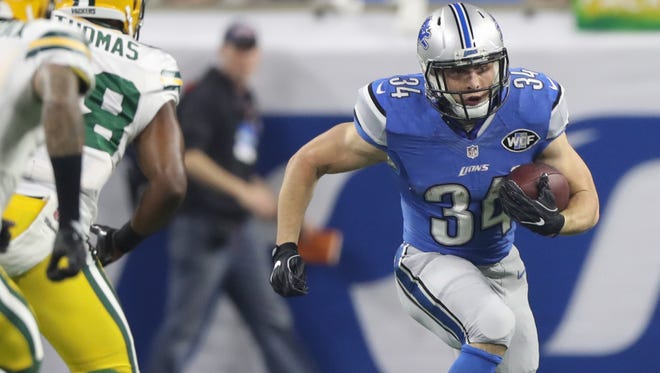 Lions running back Zach Zenner runs the ball against the Green Bay Packers during first quarter action Sunday, Jan. 1, 2017 at Ford Field.