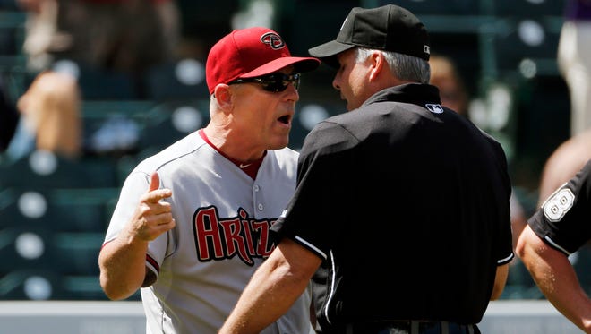 Arizona Diamondbacks manager Chip Hale argues with umpire Tim Timmons about a foul ball call during the second inning of the first game of a double header against the Colorado Rockies on Tuesday, Sept. 1, 2015, in Denver.