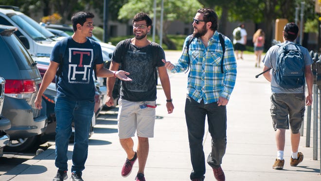 Students walk on the NMSU campus in 2015.