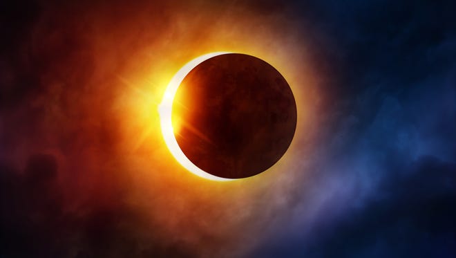 With your solar glasses or a special viewer, watch for the partial phases of the eclipse as the moon passes over the sun, a stage that lasts for a few hours. (Dreamstime/TNS)