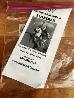 Fliers looking to recruit members for the Ku Klux Klan were found, contained in baggies, under the windshields of cars and on business doors Friday, Jan. 12, morning.