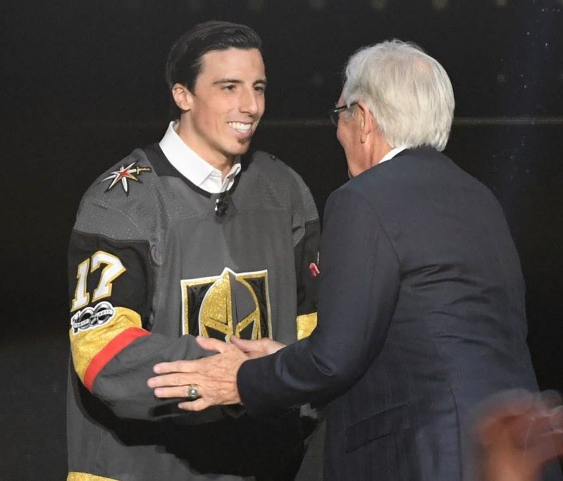 Goaltender Marc-Andre Fleury shakes hands with Vegas Golden Knights owner Bill Foley at the expansion draft.