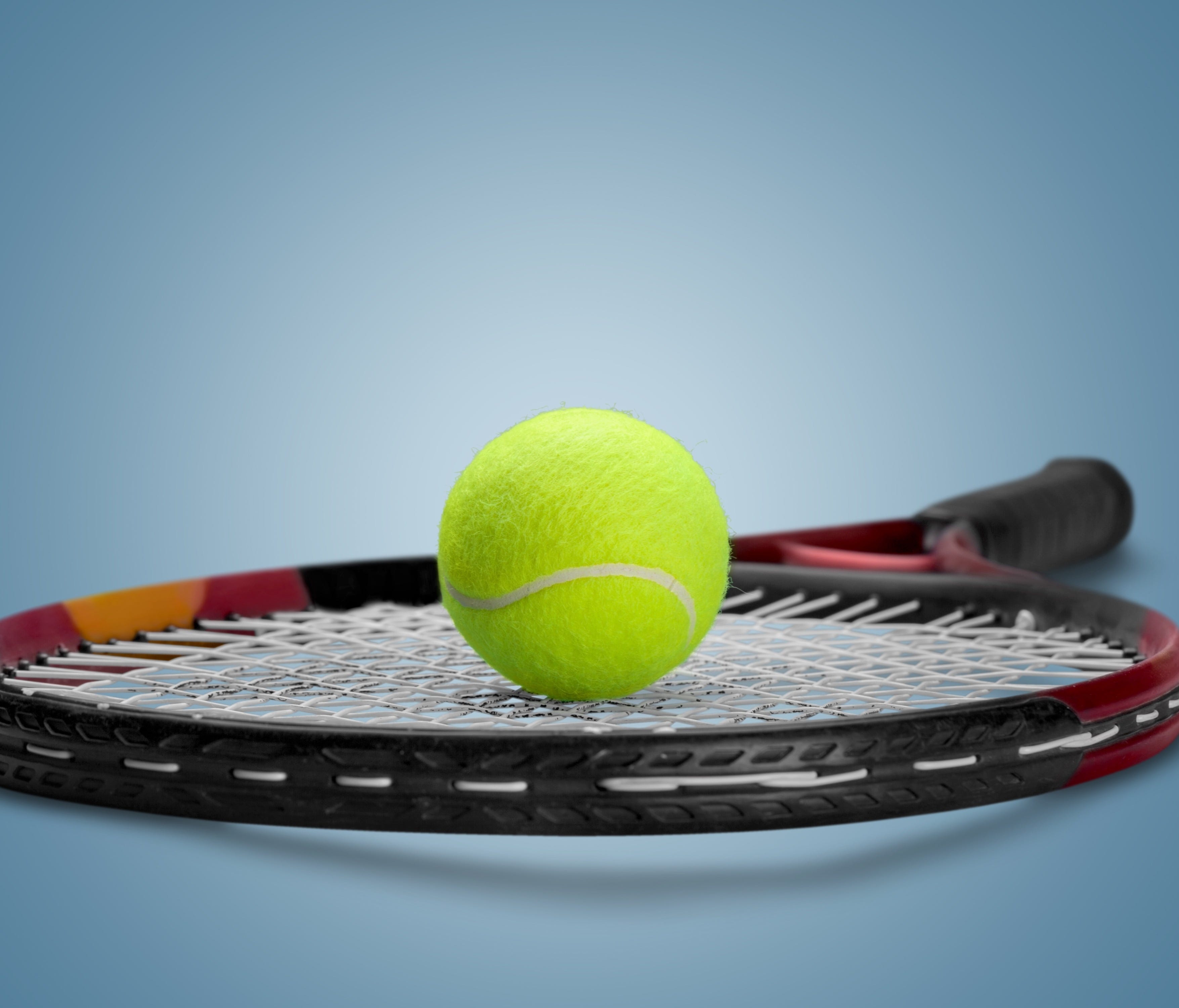 Generic view of a tennis ball and racket.