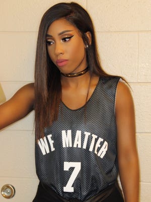 This photo provided by Atlantic Records shows Sevyn Streeter at an arena for an NBA basketball game between the Philadelphia 76ers and Oklahoma City Thunder in Philadelphia on Wednesday, Oct. 26, 2016. Philadelphia 76ers national anthem singer Streeter said she was told by the team she could not perform because of her "We Matter" jersey.