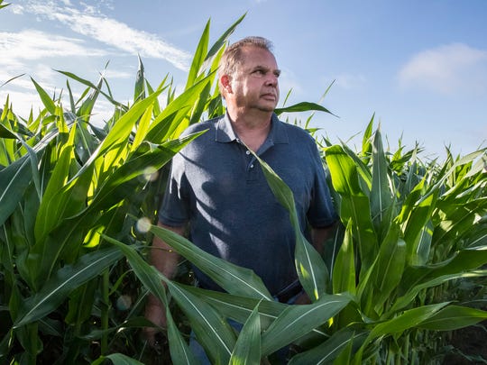 Mike Starkey, a farmer in Brownsburg, Ind., poses in