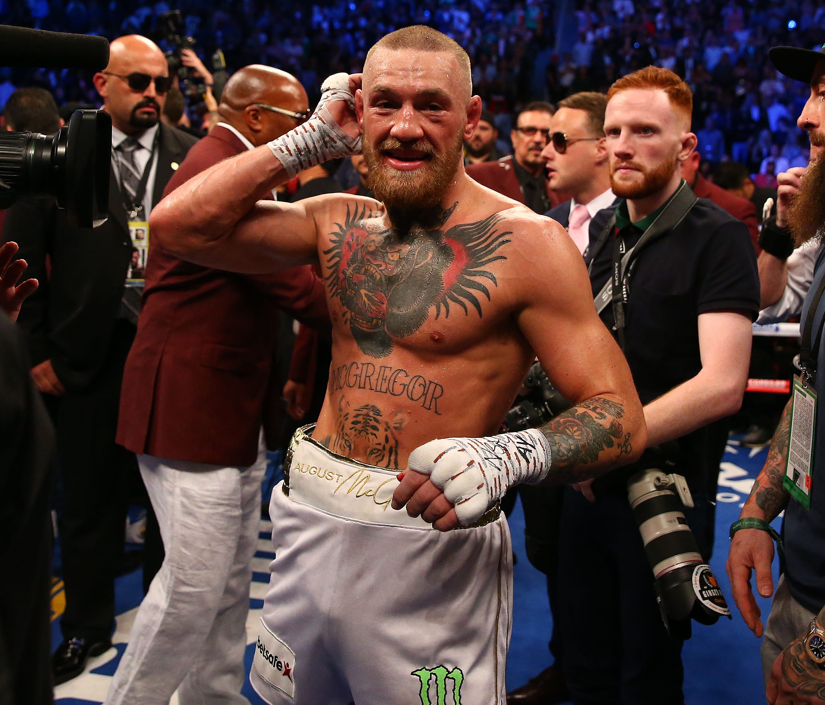 Conor McGregor reacts following his loss in the tenth round by TKO to Floyd Mayweather Jr. at T-Mobile Arena.