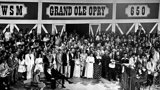 The Grand Ole Opry House opened March 16, 1974, with a standing-room only Opry performance attended by the Nixons, among other VIP guests. President Richard Nixon is playing the piano on the right.