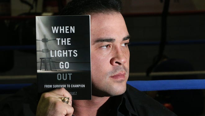 Retired El Paso boxer David Rodriguez has written a book, "When the Lights Go Out," about his life.