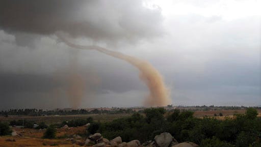 FILE - In this Thursday, May 22, 2008, file photo, a tornado touches down in Riverside, Calif. On Tuesday, Jan. 10, 2017, a twister touched down south of the state capital and registered EF0, at the lowest edge of the tornado scale that goes up to EF5. The Enhanced Fujita (EF) scale measures the intensity of tornadoes in the U.S. and Canada based on damage caused.