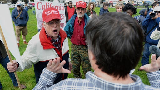 Trump supporter Jim Templeton, left, yells at an anti-Trump protester at a rally for President Donald Trump at Martin Luther King Jr. Civic Center Park in Berkeley, California on March 4.