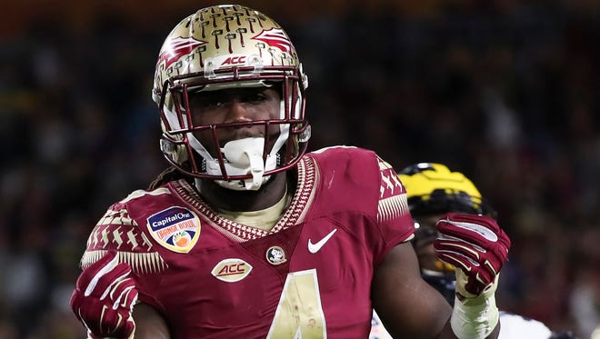 Florida State Seminoles running back Dalvin Cook (4) celebrates after a catch in the first quarter against the Michigan Wolverines at Hard Rock Stadium.