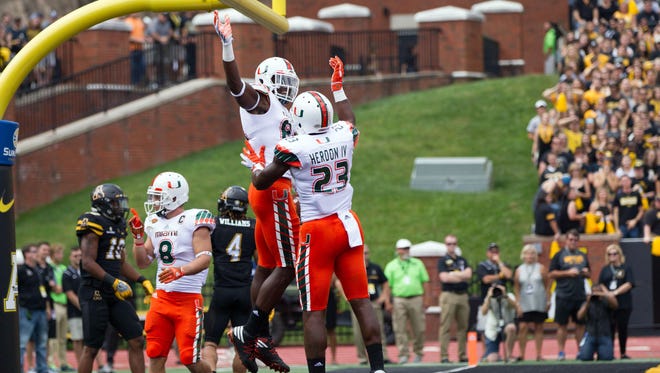 The unbeaten Miami Hurricanes are up to No. 14 in the Amway Coaches Poll.