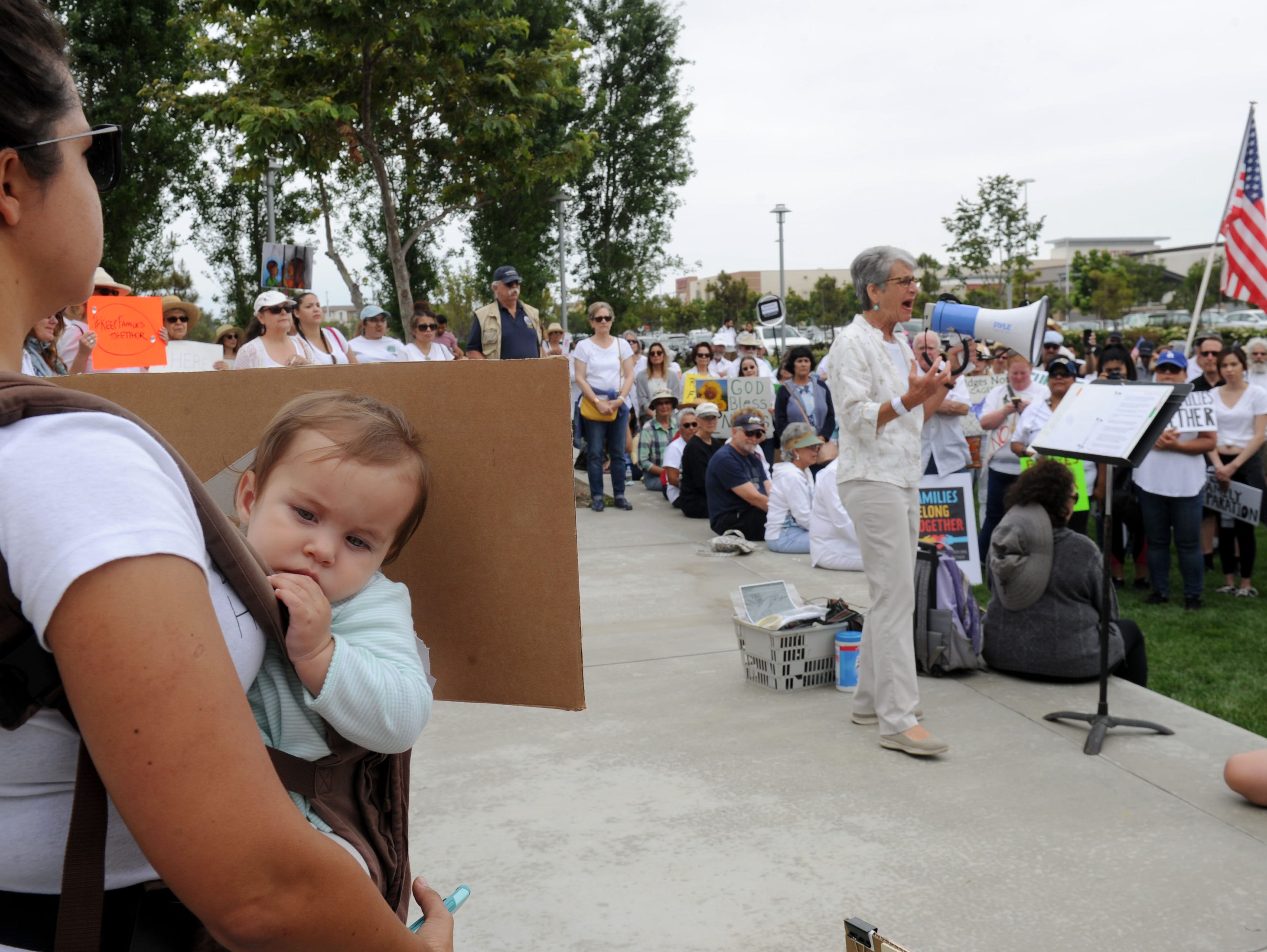 Valerie Yates holds on to her daughter Mia, 10 months
