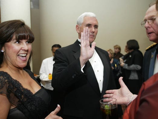 Pence and his wife, Karen, greet guests at the Indiana
