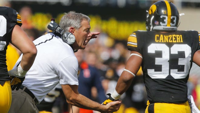 Iowa head football coach Kirk Ferentz celebrates with Jordan Canzeri after a touchdown against Illinois on Oct. 10 at Kinnick Stadium. Canzeri was a last-minute addition to Iowa’s 2011 class.