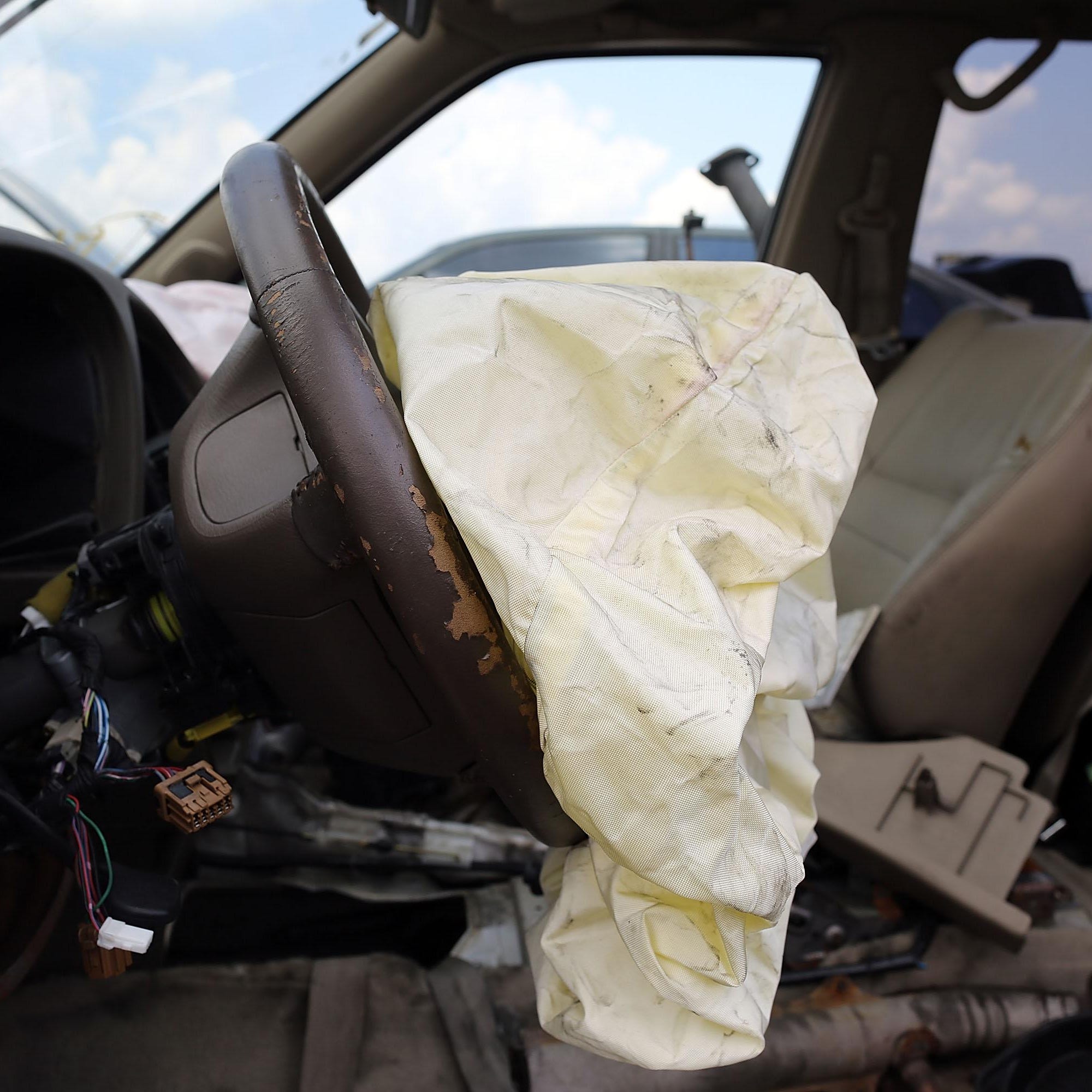A deployed airbag is seen in a salvage yard in Medley, Florida. The largest automotive recall in history centers around the defective Takata Corp. air bags that are found in millions of vehicles that are manufactured by BMW, Chrysler, Daimler Trucks, Ford, General Motors, Honda, Mazda, Mitsubishi, Nissan, Subaru and Toyota.
