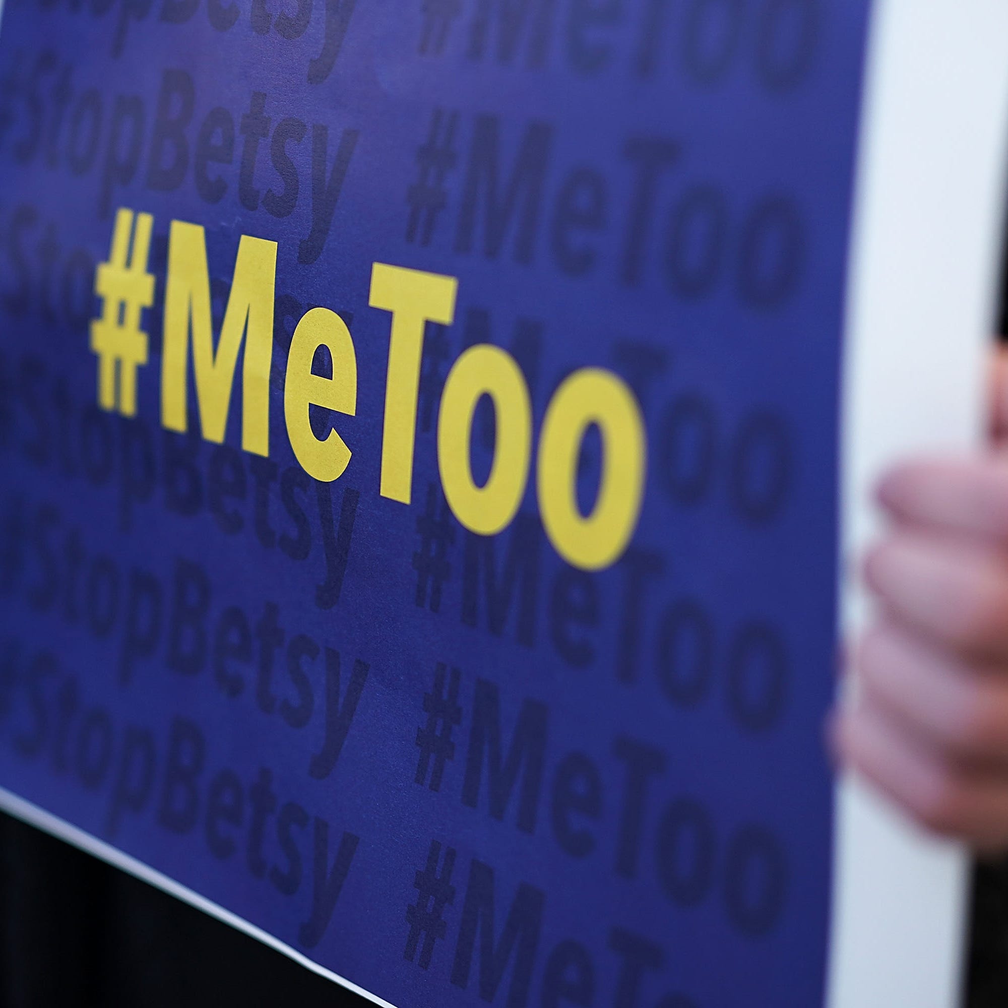 WASHINGTON, DC - JANUARY 25:  An activist holds a #MeToo sign during a news conference on a Title IX lawsuit outside the Department of Education January 25, 2018 in Washington, DC. Anti-sexual harassment groups held a news conference to announce a "landmark lawsuit against the Trump Administration over Title IX" and the "unconstitutional Title IX policy harming student survivors of sexual violence   and harassment."  (Photo by Alex Wong/Getty Images) ORG XMIT: 775109045 ORIG FILE ID: 910224306
