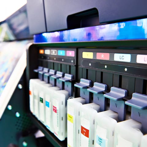 Ink cartridges in a color printer.