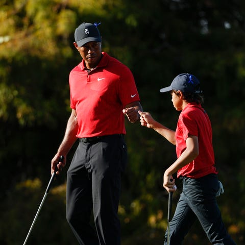 FILE  -Tiger Woods fist bumps his son Charlie Wood