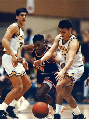 1992: Andre Galloway of Waterloo East strips the ball from Jason Laxton of Indianola as Jim Janvirn watches. Indianola won, 87-74.