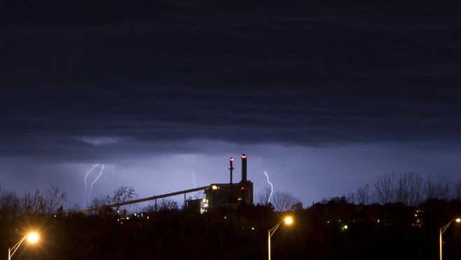 Lightning silhouettes the Purdue University power plant during a 2012 storm.