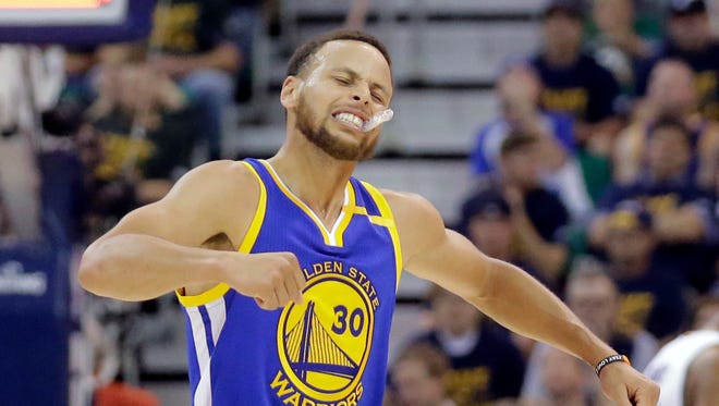 Golden State Warriors guard Stephen Curry (30) celebrates after a teammate score against the Utah Jazz in the second half during Game 4 of the NBA basketball second-round playoff series Monday, May 8, 2017, in Salt Lake City. The Warriors completed a second-round sweep of the Utah Jazz with a 121-95 victory. (AP Photo/Rick Bowmer)