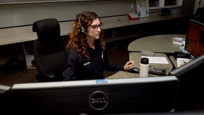 Brittany Farrell, a Ventura County Fire Department dispatcher, answers a call at the Camarillo communications center.